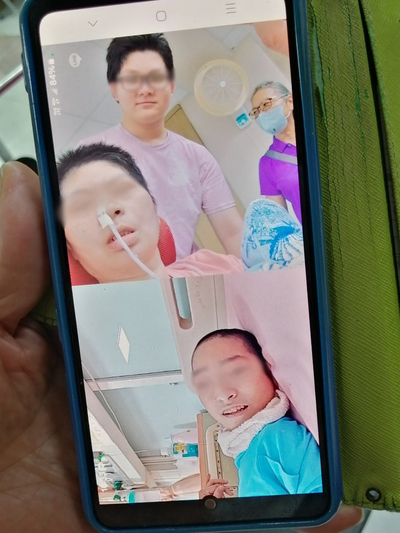 母子三人在手機視訊裡團圓 由上至下分別為阿宏、阿宏的母親、小瑞